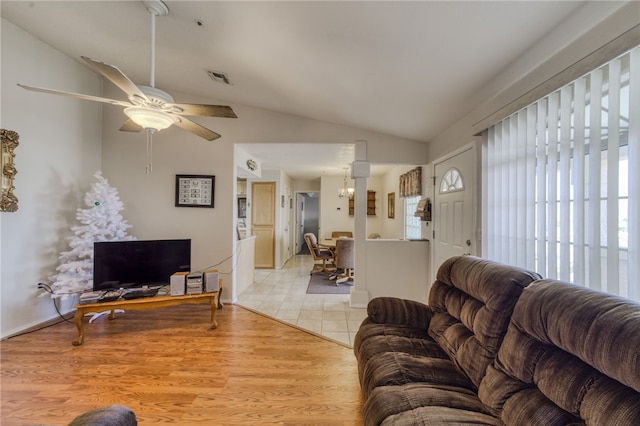 3408 Sunriver Rd Unit 207 B6, Bullhead City, AZ 86429 - living area with lofted ceiling, a ceiling fan, and a chandelier