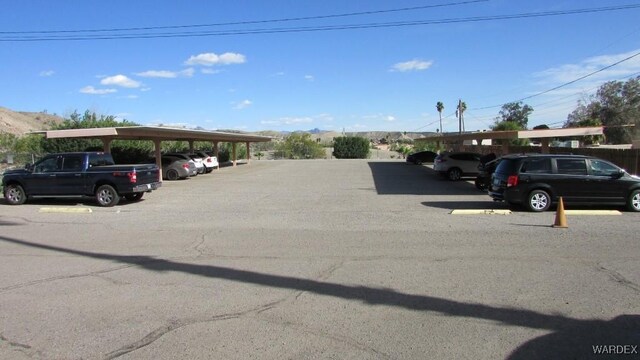 view of partially covered parking lot