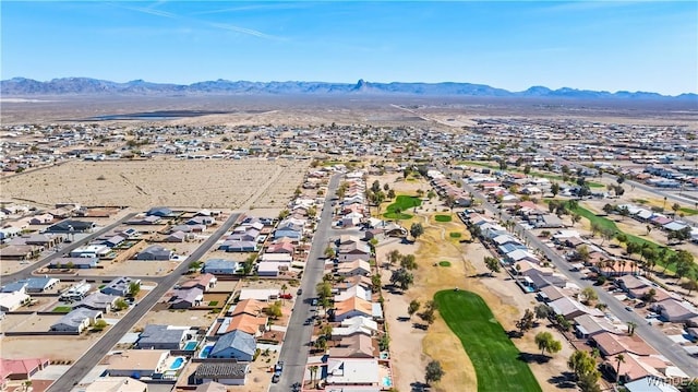 drone / aerial view featuring a residential view and a mountain view