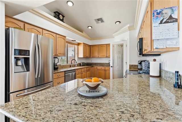 kitchen featuring light stone counters, a sink, visible vents, appliances with stainless steel finishes, and crown molding