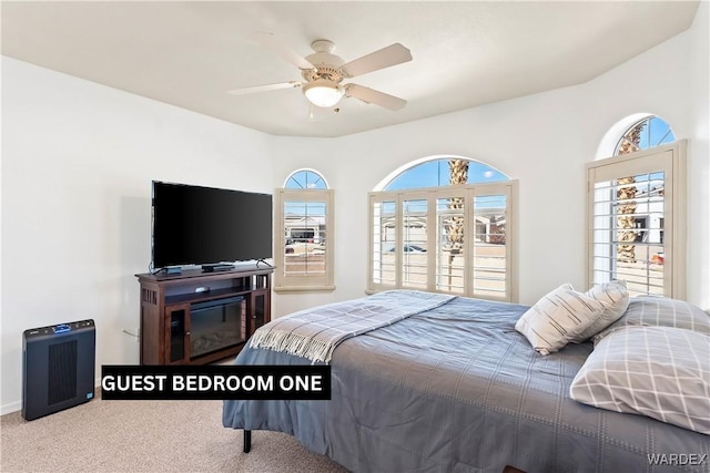 bedroom with ceiling fan and carpet