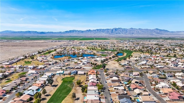 birds eye view of property with a residential view and a water and mountain view