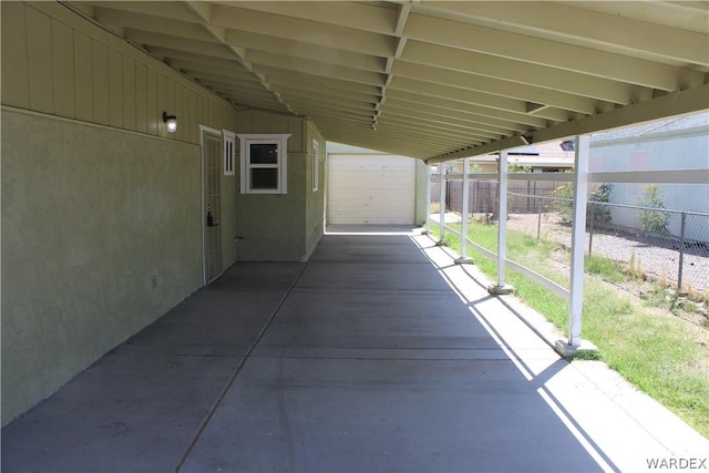 view of patio / terrace featuring a carport and fence