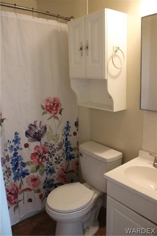 bathroom with toilet and vanity