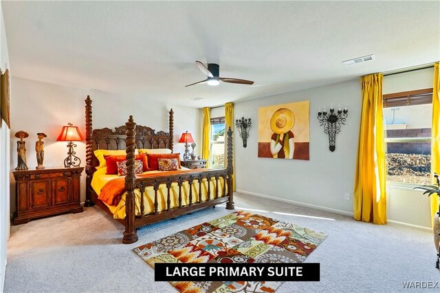 bedroom with light carpet, a ceiling fan, visible vents, and baseboards