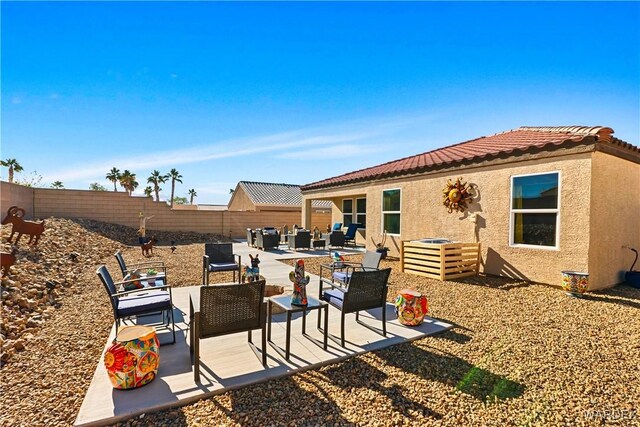 view of patio / terrace featuring a fenced backyard and an outdoor living space