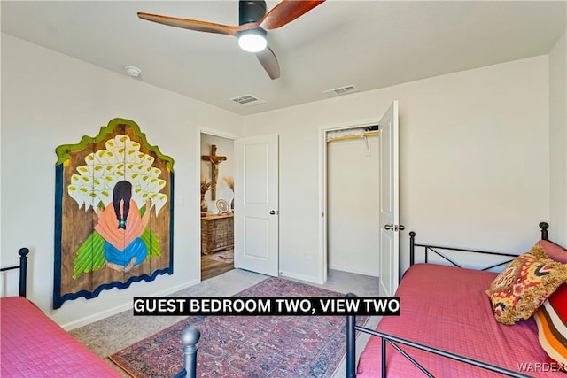 bedroom with ceiling fan, visible vents, and light colored carpet