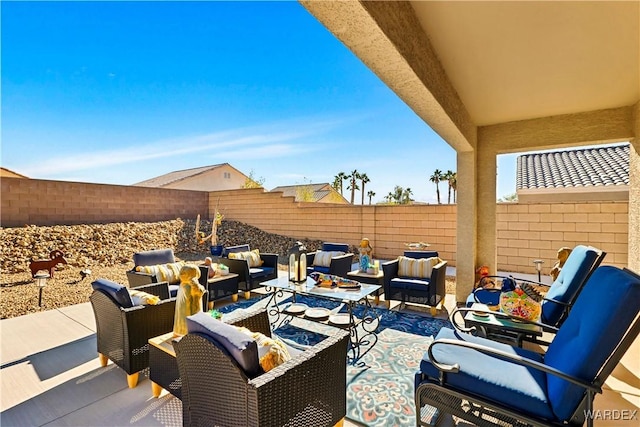 view of patio featuring a fenced backyard and an outdoor living space