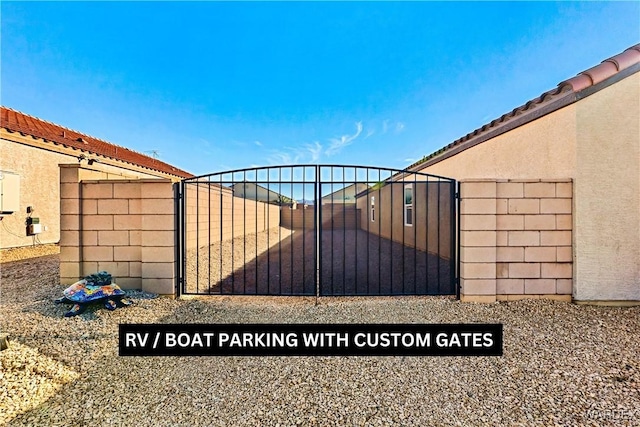 view of gate with fence