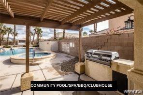 view of patio featuring area for grilling, fence, a hot tub, and a community pool