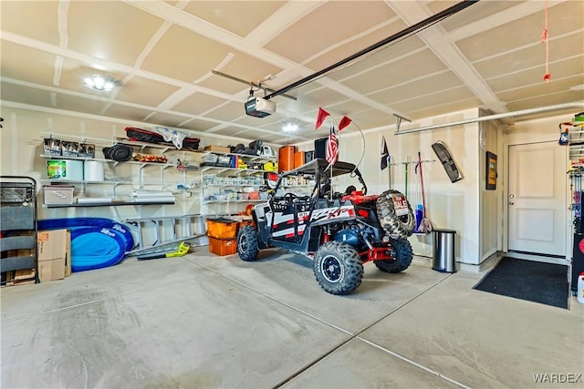 garage featuring a garage door opener