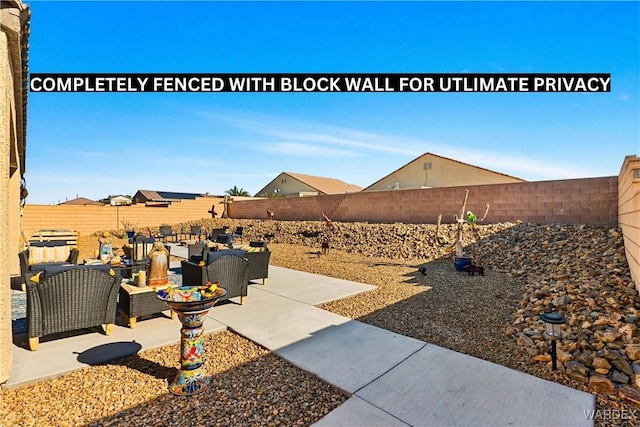 view of yard featuring a fenced backyard, a patio, and an outdoor living space