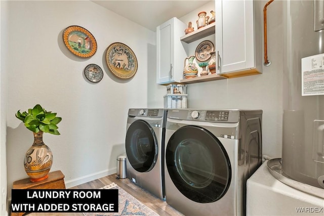 washroom with cabinet space, baseboards, light wood-style flooring, electric water heater, and separate washer and dryer