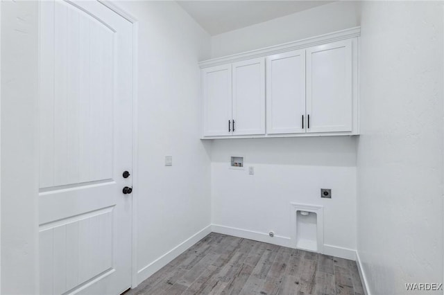 washroom with hookup for a washing machine, cabinet space, light wood-style flooring, gas dryer hookup, and electric dryer hookup