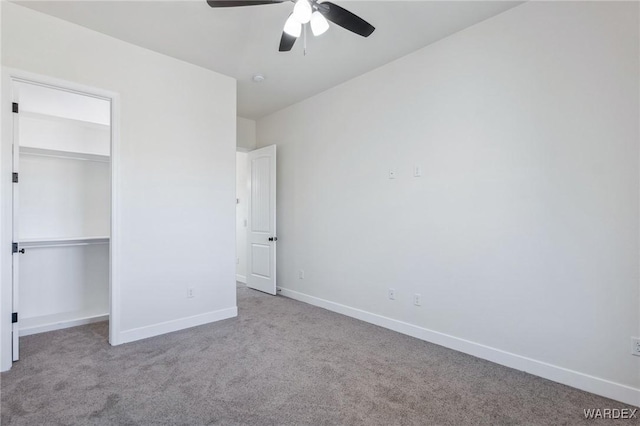 unfurnished bedroom with light carpet, a ceiling fan, baseboards, and a closet