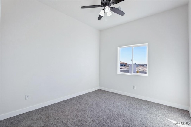 carpeted empty room featuring baseboards and a ceiling fan