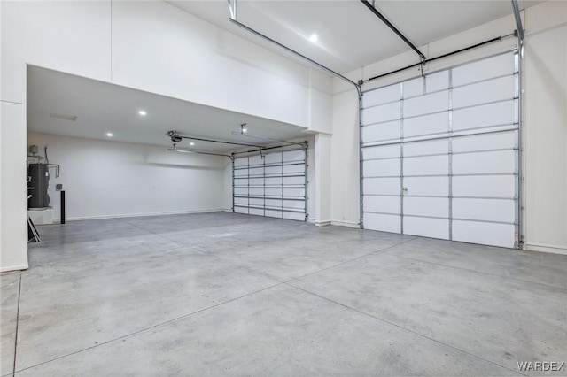 garage with water heater and baseboards