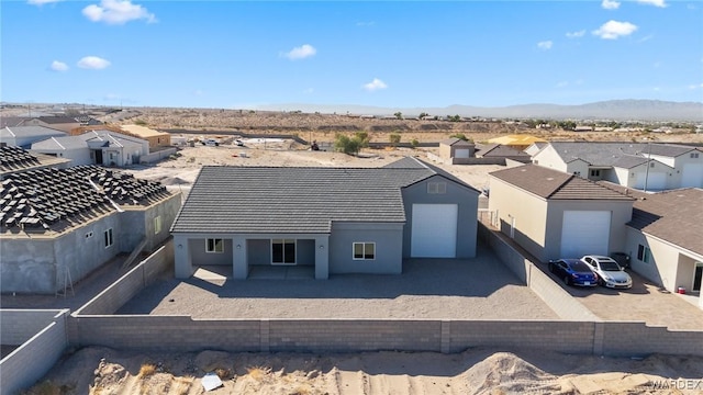 drone / aerial view featuring a residential view and a mountain view