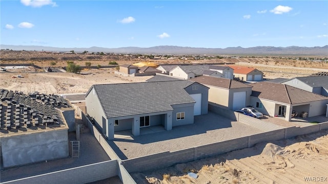 birds eye view of property with a residential view and a mountain view