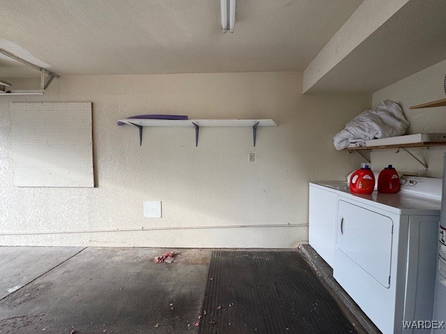 clothes washing area featuring laundry area and separate washer and dryer