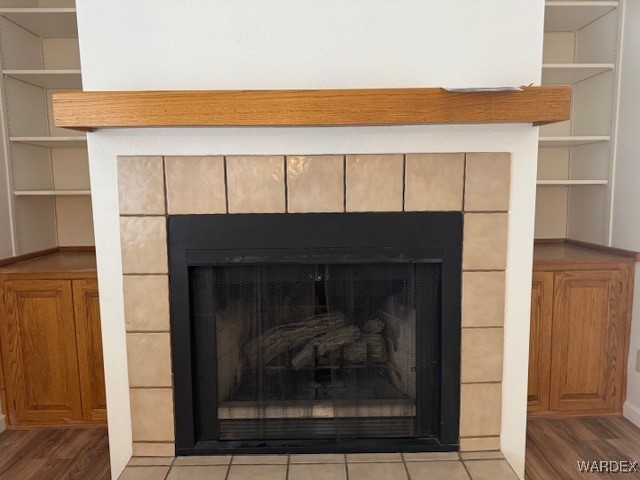 room details with a fireplace and wood finished floors