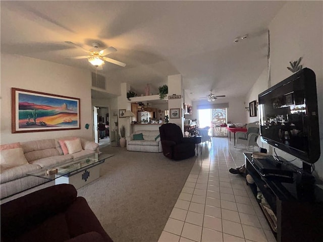 2217 E Emerald River Way, Fort Mohave, AZ 86426 - living area featuring a ceiling fan, light tile patterned floors, light colored carpet, and vaulted ceiling