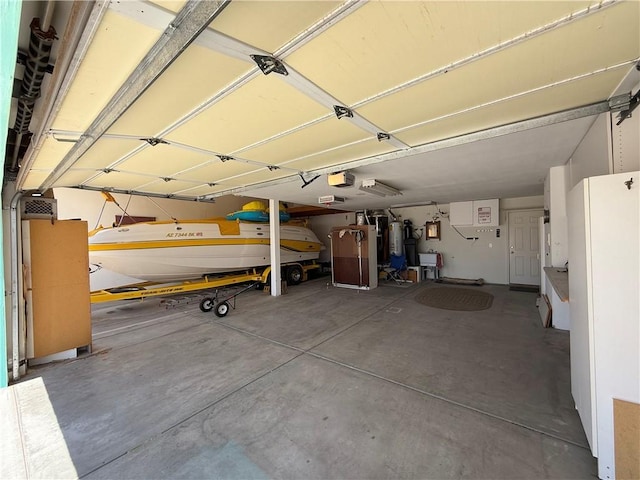 2217 E Emerald River Way, Fort Mohave, AZ 86426 - garage featuring a garage door opener and water heater