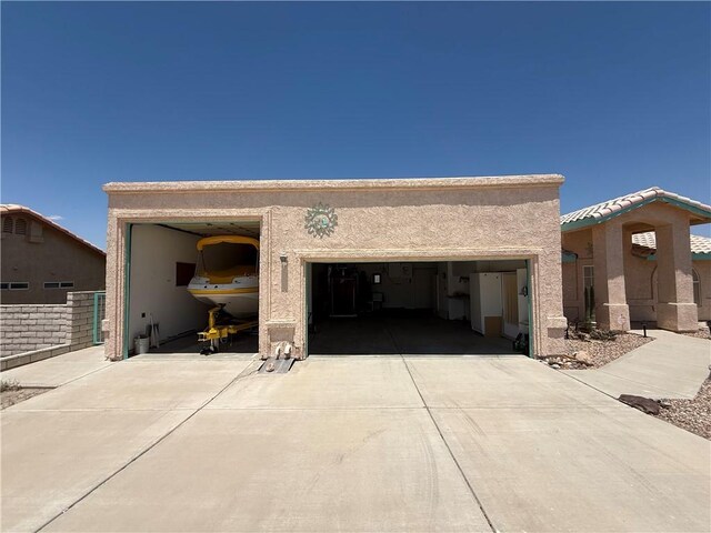 2217 E Emerald River Way, Fort Mohave, AZ 86426 - view of front of house featuring concrete driveway, stucco siding, and an attached garage