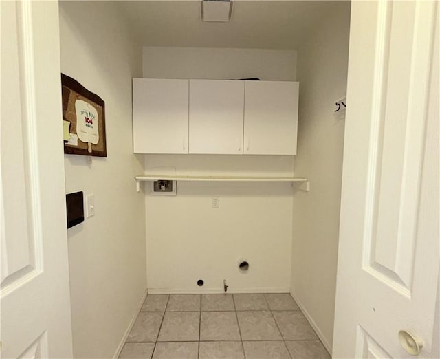 2217 E Emerald River Way, Fort Mohave, AZ 86426 - laundry room with cabinet space, gas dryer hookup, light tile patterned flooring, and washer hookup