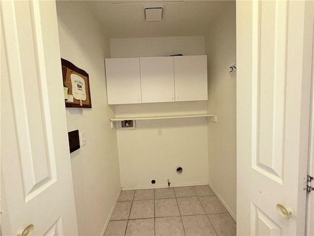 2217 E Emerald River Way, Fort Mohave, AZ 86426 - laundry area with cabinet space, hookup for a washing machine, light tile patterned floors, and gas dryer hookup