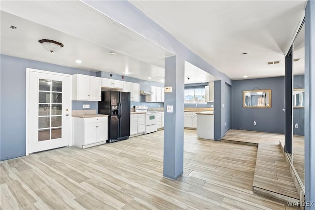 kitchen with white range with electric stovetop, white cabinets, black refrigerator with ice dispenser, light countertops, and wood finish floors