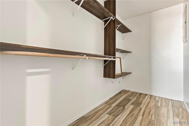 walk in closet featuring wood tiled floor