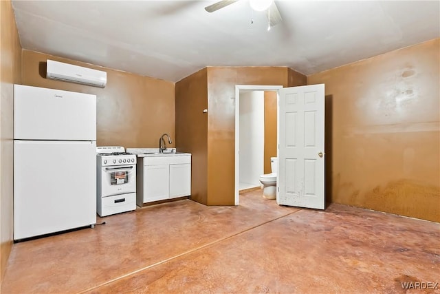 kitchen featuring white appliances, white cabinets, concrete flooring, a sink, and a wall mounted AC