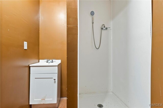 full bath featuring a shower stall and vanity