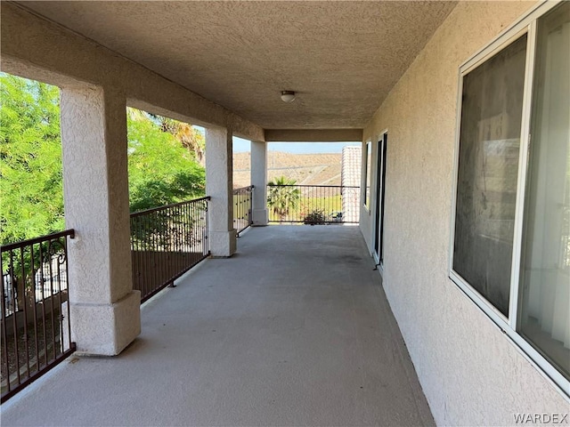 view of patio with a balcony