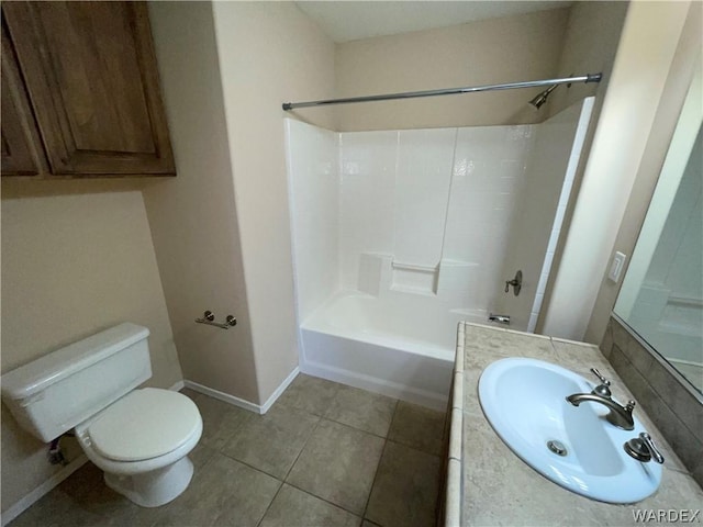 full bathroom featuring bathing tub / shower combination, toilet, vanity, tile patterned flooring, and baseboards