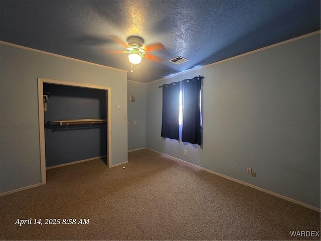 unfurnished bedroom with visible vents, baseboards, a closet, carpet, and a textured ceiling