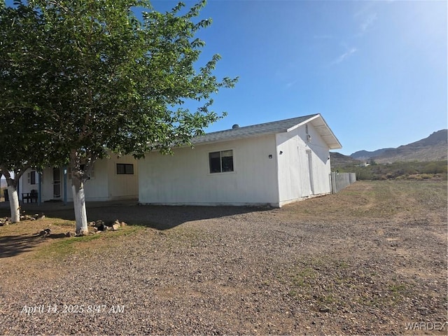 view of side of home featuring a mountain view