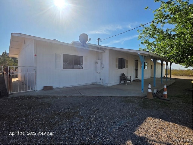 back of property featuring a patio