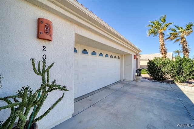 garage featuring driveway