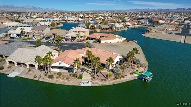 bird's eye view featuring a residential view and a water and mountain view