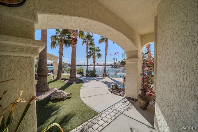 view of patio featuring a water view