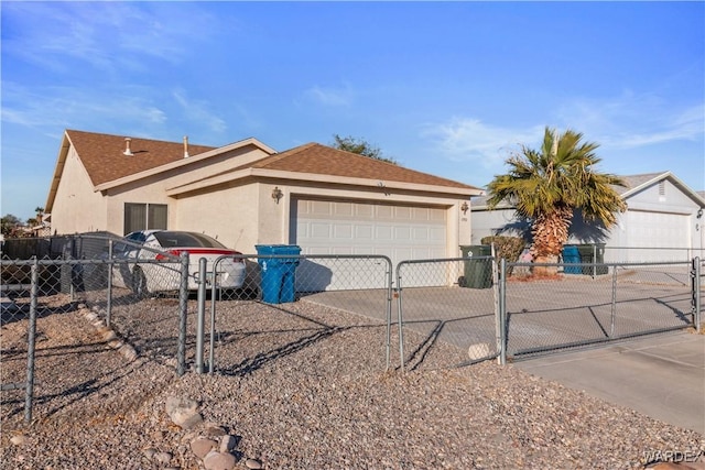 single story home with concrete driveway, fence, an attached garage, and stucco siding