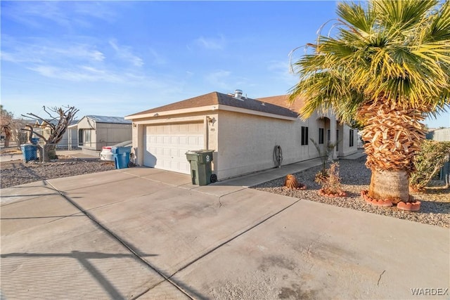 view of property exterior featuring driveway, an attached garage, fence, and stucco siding