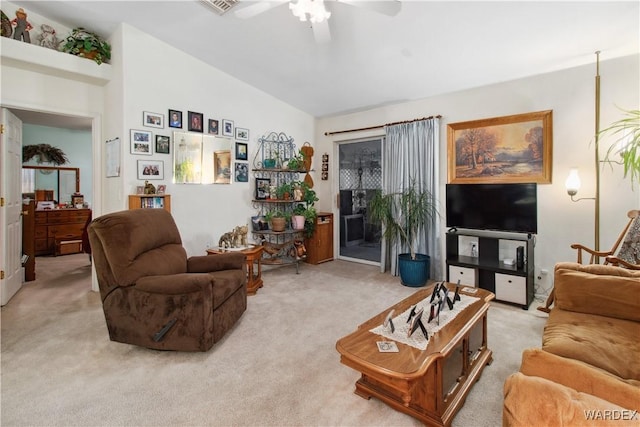 carpeted living area with a ceiling fan