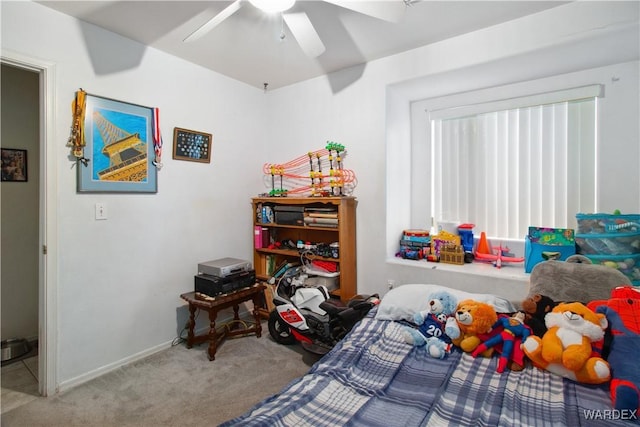 bedroom with carpet, a ceiling fan, and baseboards