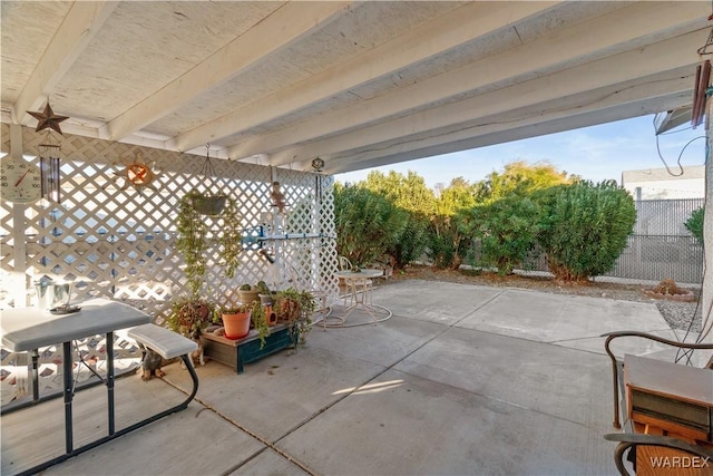 view of patio featuring fence