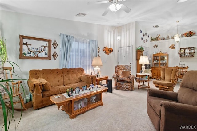 living area featuring ceiling fan, carpet, and visible vents