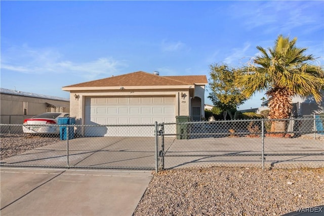 view of front of home with a garage, driveway, fence, and stucco siding