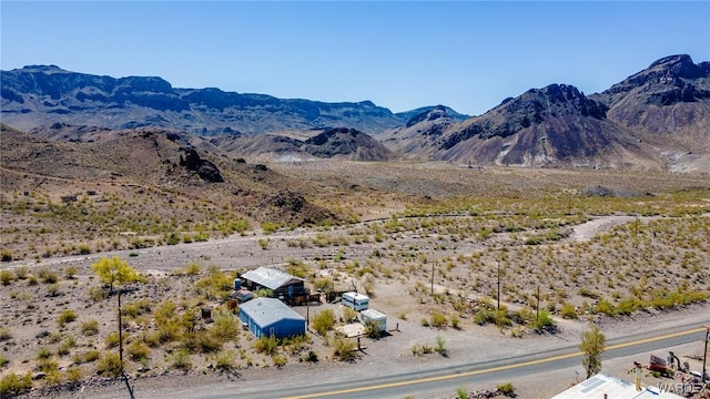 mountain view featuring view of desert and a rural view